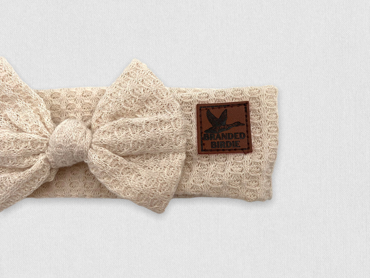 Waffle Knit Cotton Baby Bow Headband With Leather Patch - Oatmeal Cream - Branded Birdie